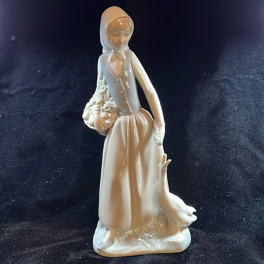 NAO by Lladro #26G/M - Girl With Duck (Hungry Goose)